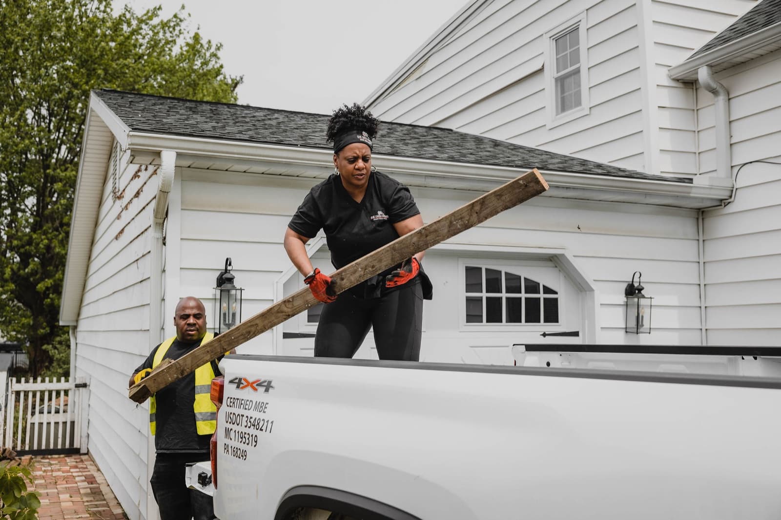 She Does Hauling crew loading a truck